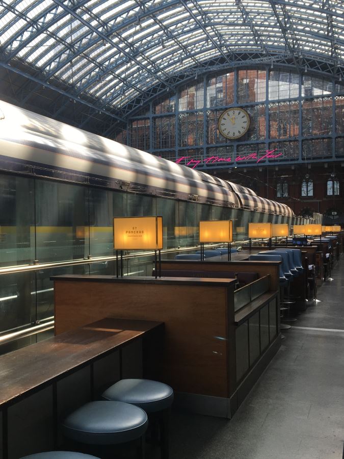 Seats next to a train at the Searcy's Champagne Bar in St Pancras