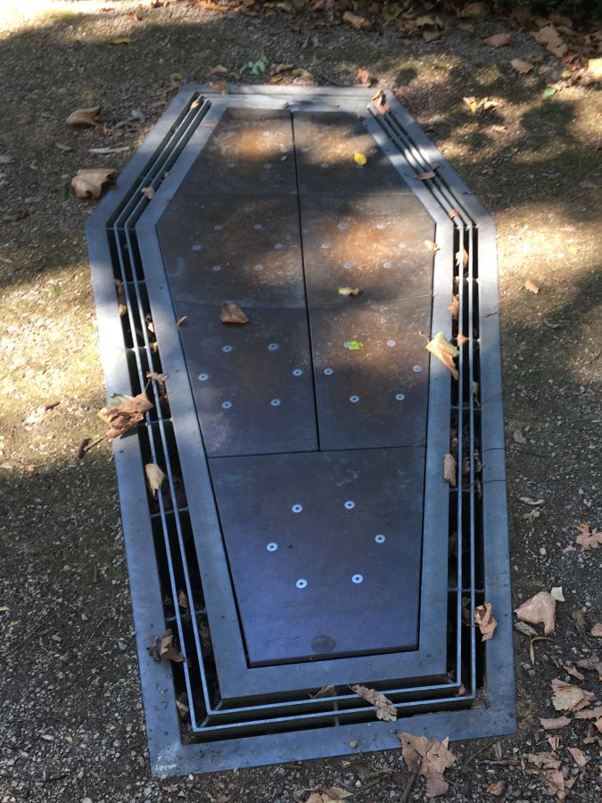 Memorial to Jseph Grimaldi in London. The coffin shape on the ground is metal with panels on it. If you step on these panels they make muscial sounds sounds.