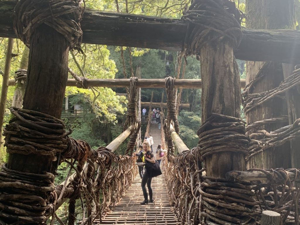 People cross the Kazurabashi bridge in the Iya Valley Japan