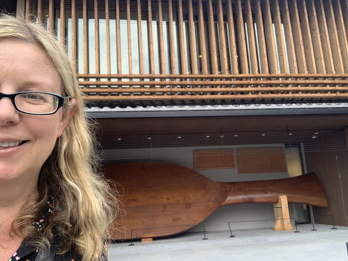 Helen from Differentville stands by the giant rice scoop in Miyajima, Japan