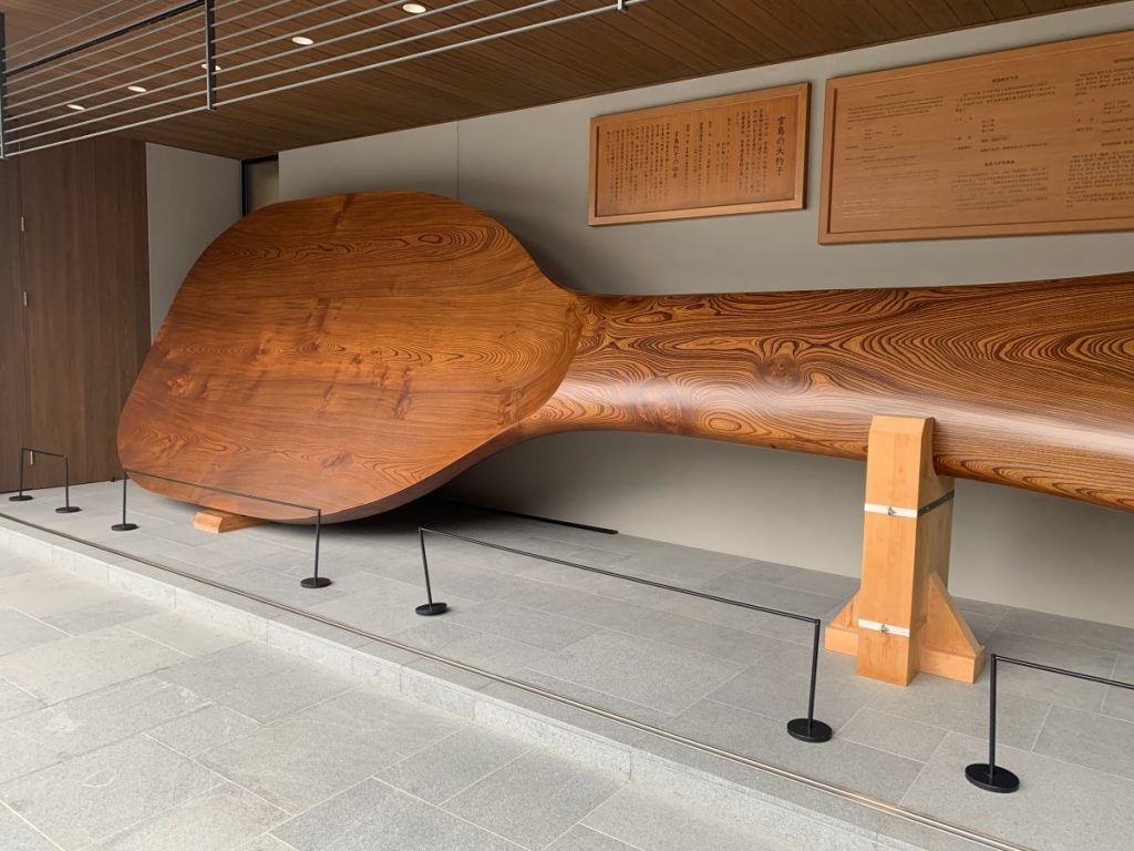 Giant wooden rice scoop displayed in Miyajima