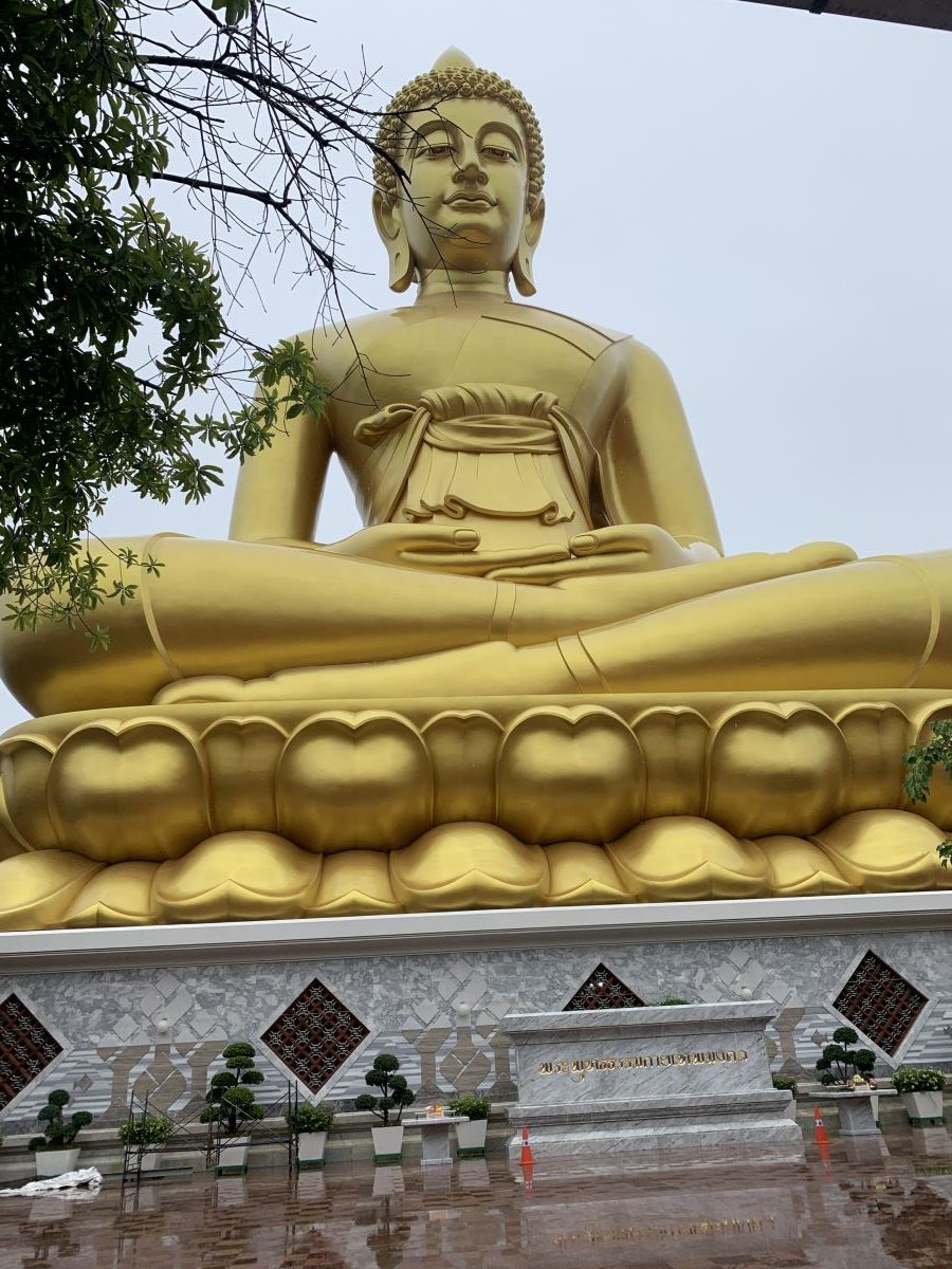 The giant gold Buddha sitting on a plinth at Wat Paknum Phasi, Bangkok