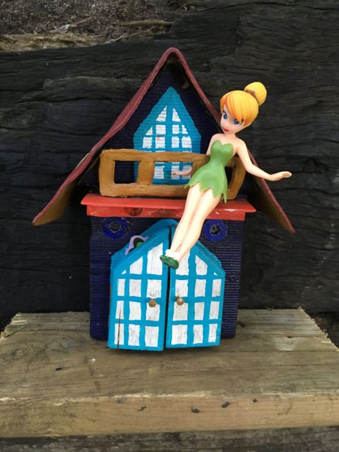 Tinkerbell doll by a house in Wendy's Secret Garden, Sydney