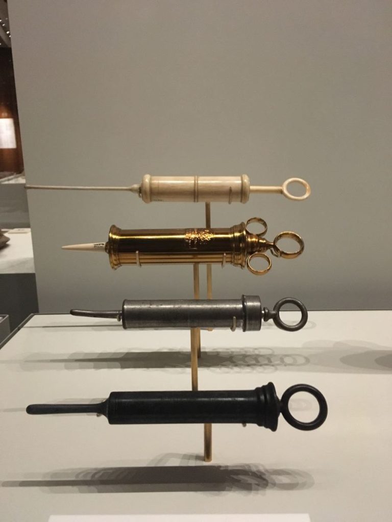 Metal, wooden and pottery enema tubes displayed at the Wellcome Collection, London